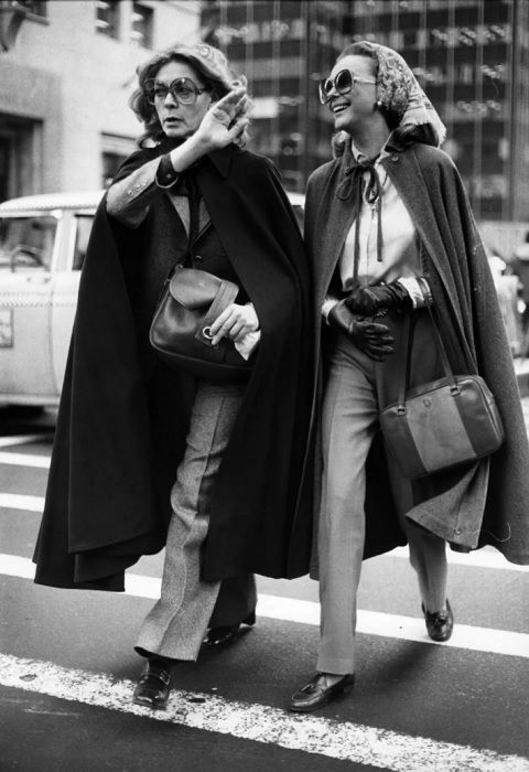 Two women crossing the road