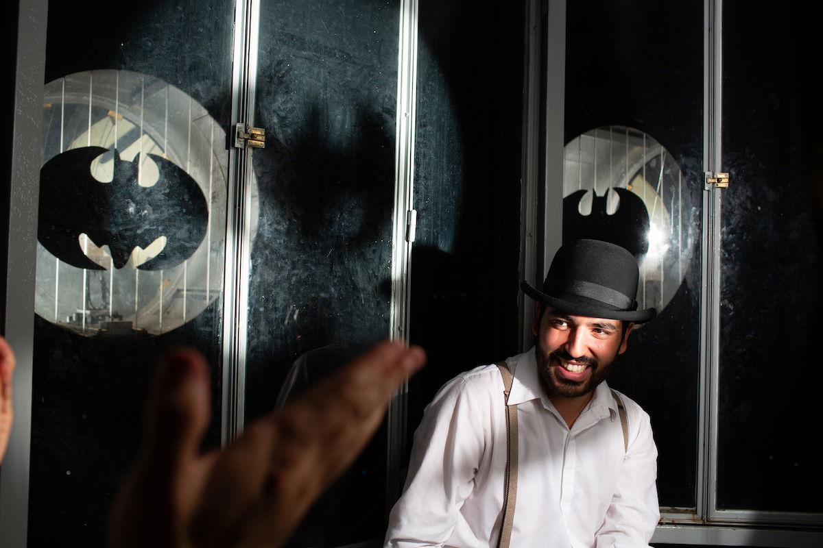 image of man on stage with bowler hat edited white balance in lightroom