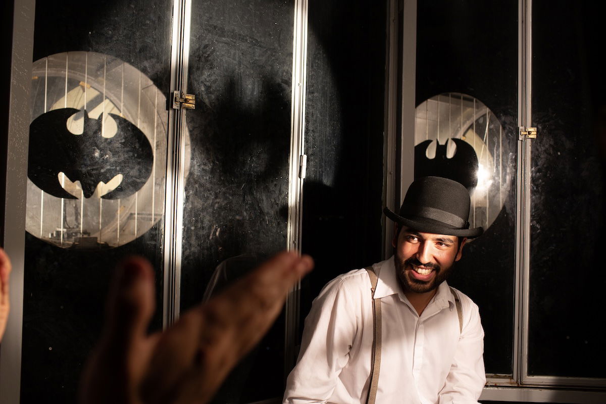 image of man on stage with bowler hat with flurescent preset