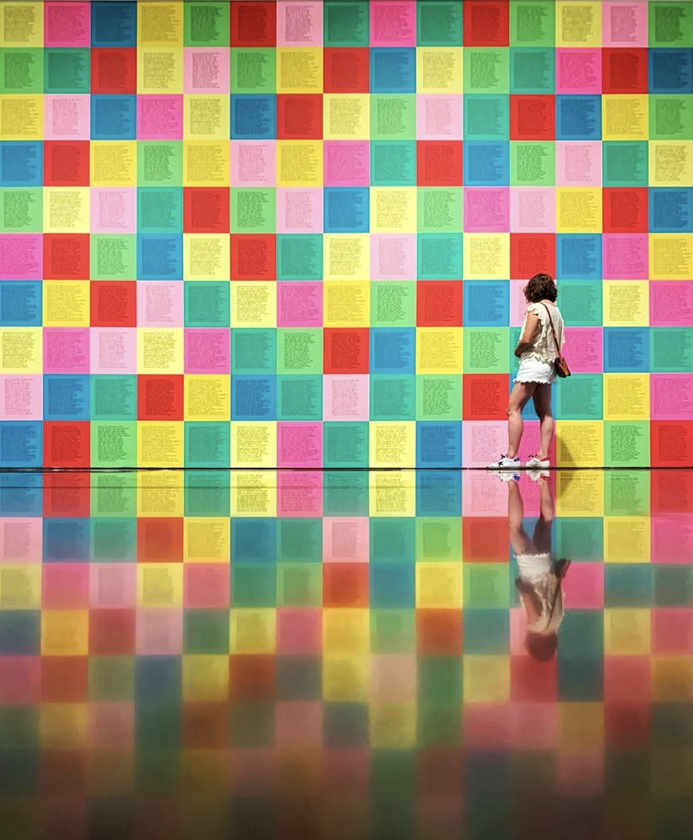 person standing in front of colored squares 