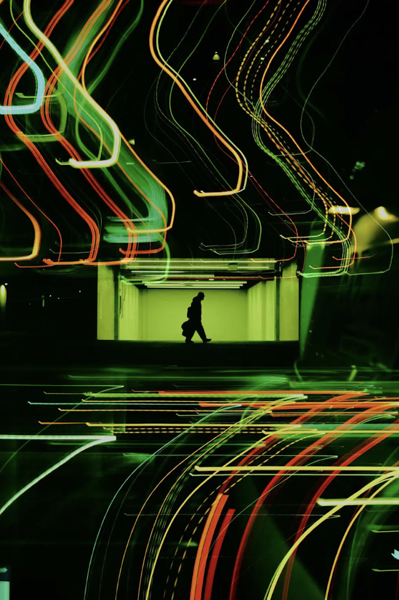 light trails photograph of man at night 